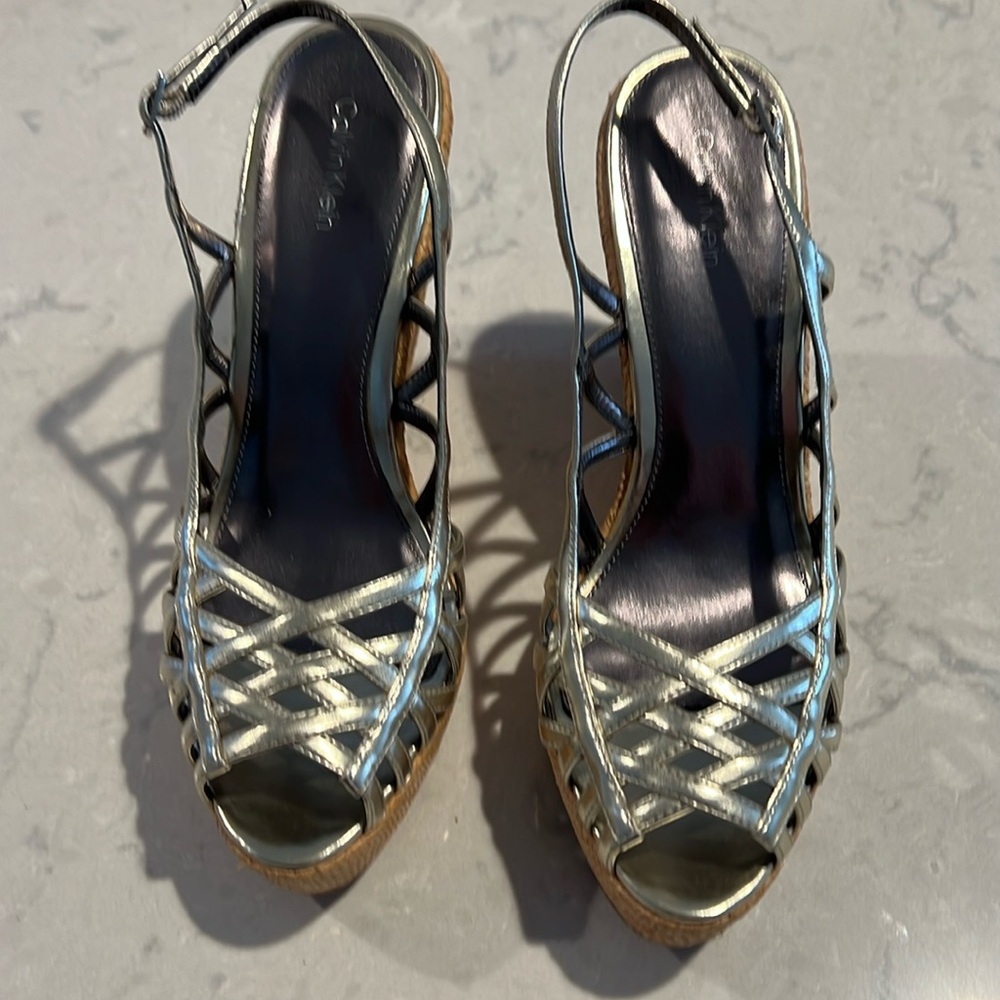 New Calvin Klein gold wedges!! Never Worn!!!  Size 8, $25